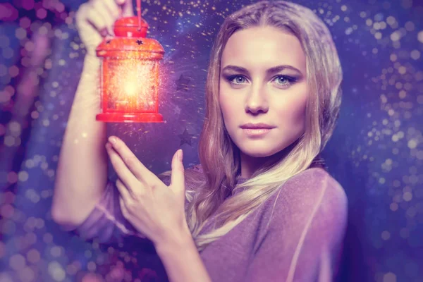 Beautiful woman with glowing lantern — Stock Photo, Image