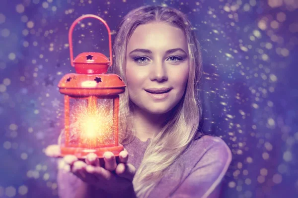 Beautiful woman with glowing lantern — Stock Photo, Image