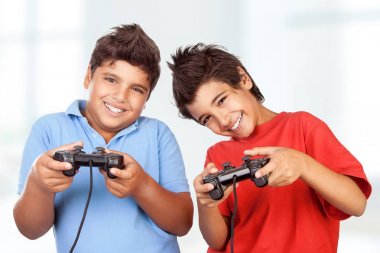 Happy boys playing video games clipart