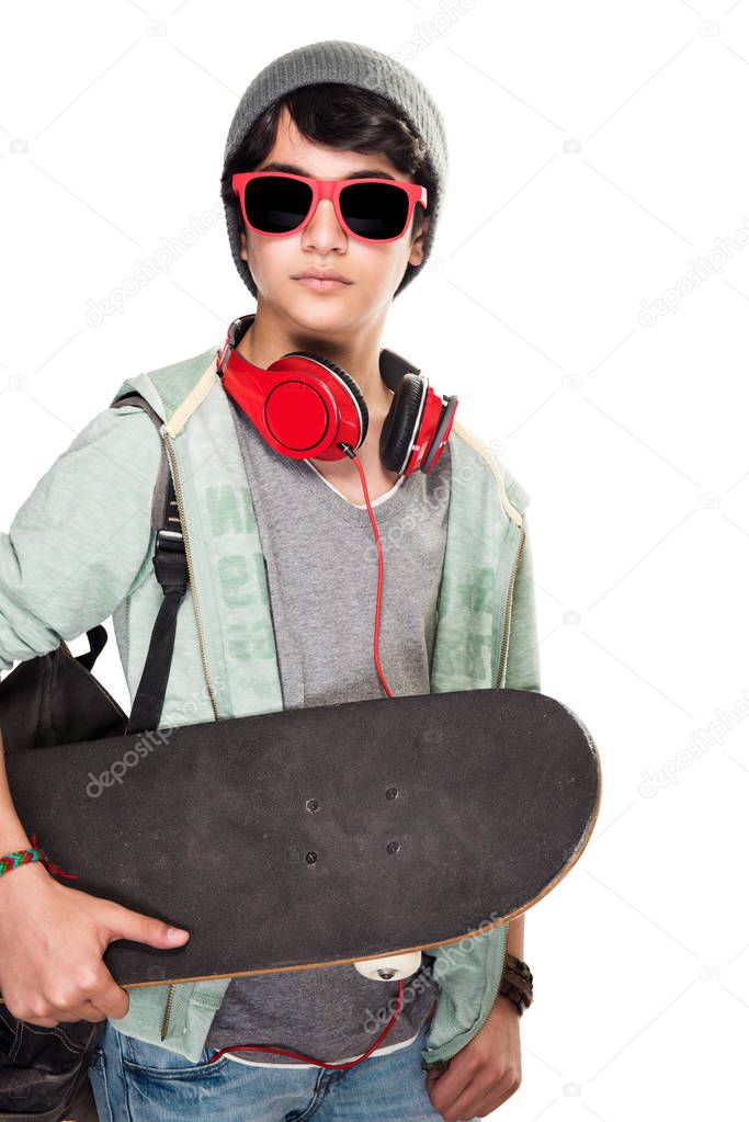 Stylish boy with skateboard