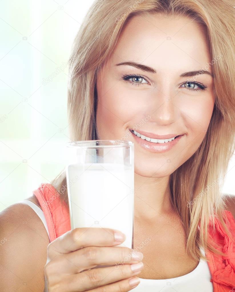 Healthy girl drinking milk