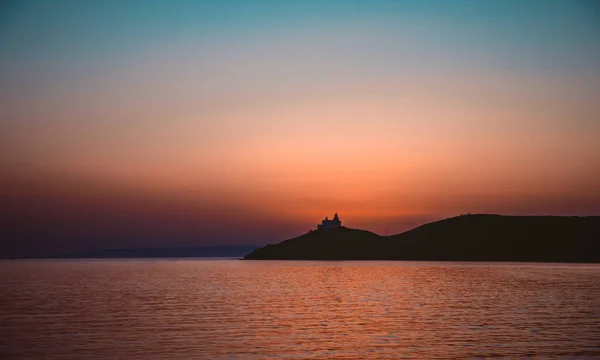 Deniz feneri silüeti — Stok fotoğraf
