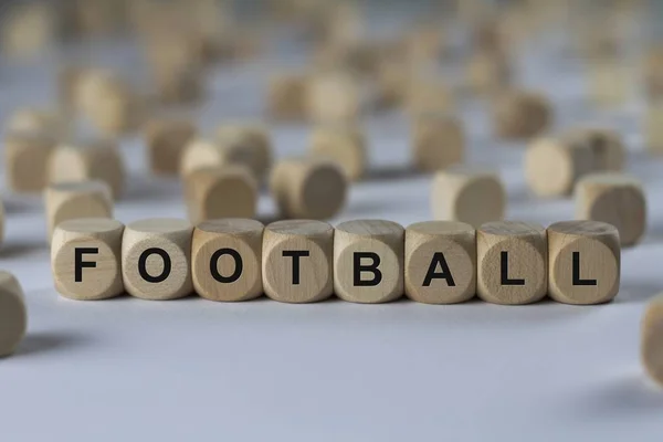Voetbal kubus met letters, ondertekenen met houten kubussen — Stockfoto