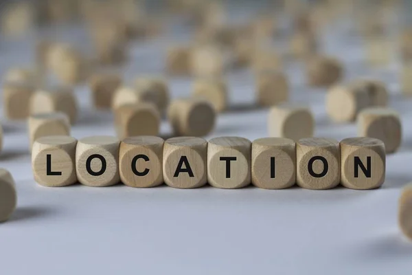 Location   cube with letters, sign with wooden cubes — Stock Photo, Image