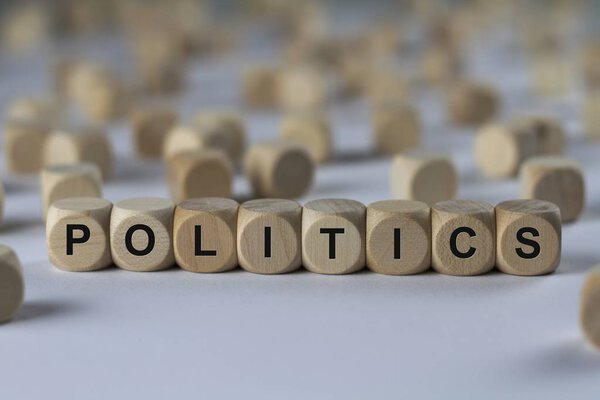politics   cube with letters, sign with wooden cubes