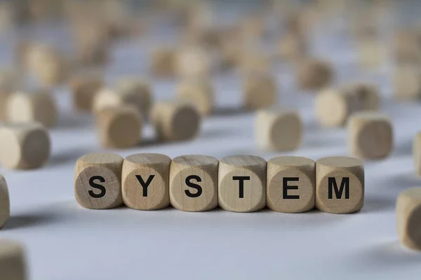 Stereokubus van het systeem met letters, ondertekenen met houten kubussen — Stockfoto