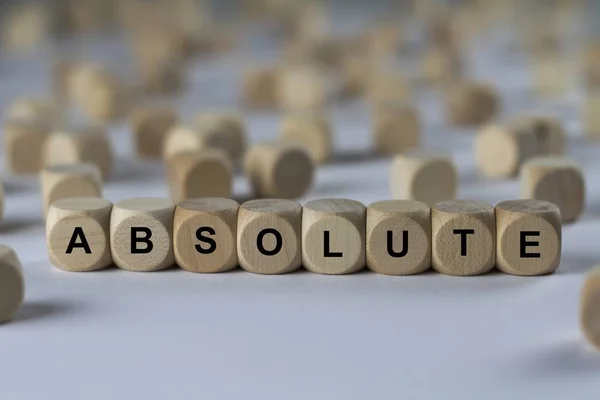 Cubo absoluto com letras, sinal com cubos de madeira — Fotografia de Stock