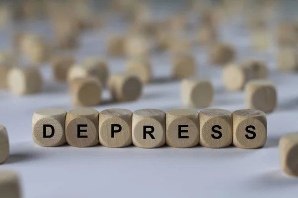 Cubo depresso con lettere, segno con cubi di legno — Foto Stock