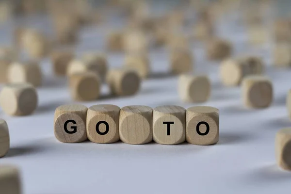 Go to   cube with letters, sign with wooden cubes — Stock Photo, Image