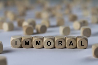 immoral   cube with letters, sign with wooden cubes clipart