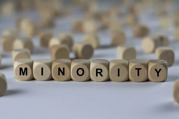 Minderheid kubus met letters, ondertekenen met houten kubussen — Stockfoto