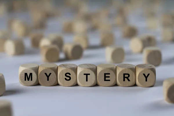 Mystery   cube with letters, sign with wooden cubes — Stock Photo, Image