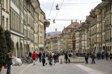 Crowded street in the old town of Bern clipart