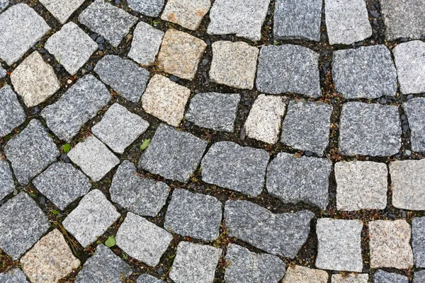 Granit kullerstenarna skapar en bakgrund — Stockfoto