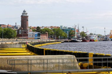 Lighthouse and harbor quay clipart