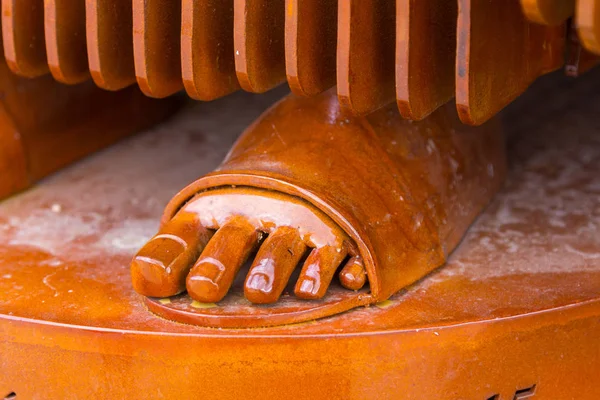 Detail of a foot Figure on iron sheets of a virgin — Stock Photo, Image