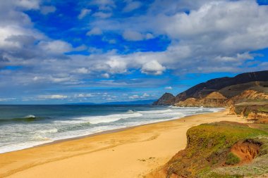 Rugged beach in Pacifica California on a cloudy day clipart