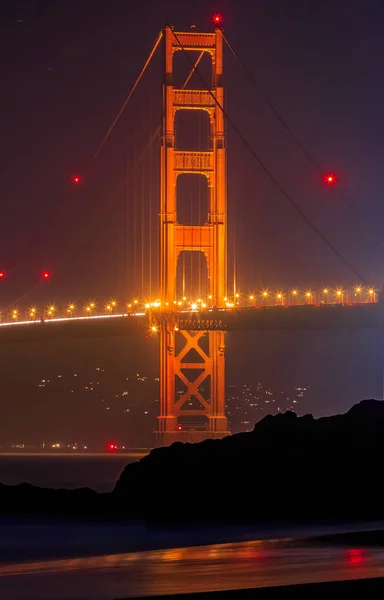 Golden Gate Bridge in San Francisco from Baker Beach at sunset — Stock Photo, Image