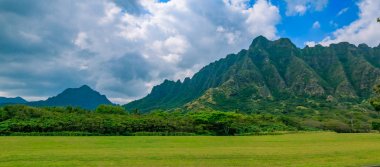 Panorama of the mountain range by famous Kualoa Ranch in Oahu, Hawaii clipart