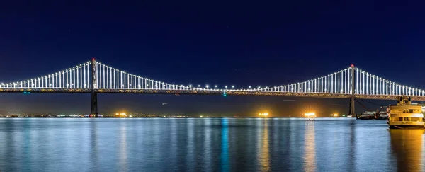 Panoramic view of the Bay Bridge from famous wooden Pier 7 at sunset — Stock Photo, Image