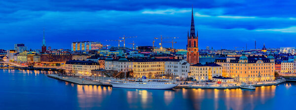 Panoramic sunset view onto Stockholm old town Gamla Stan and Rid