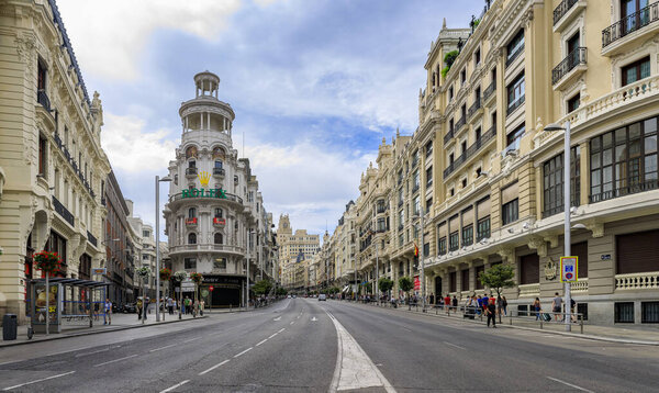 Madrid, Spain - June 5, 2017: Panorama with famous Edificio Grassy building with the Rolex sign and beautiful buildings on Gran Via shopping street