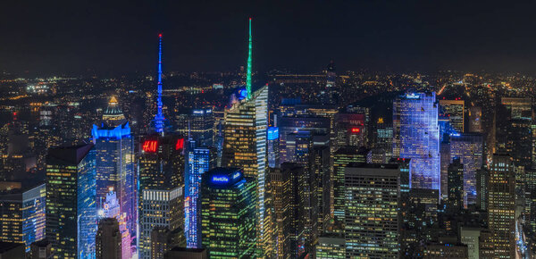 Sunset aerial panorama of iconic Times Square skyscrapers, major commercial and tourist destination in New York, USA