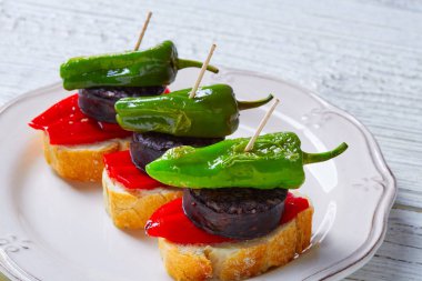 pinchos Burgos morcilla with padron pepper clipart