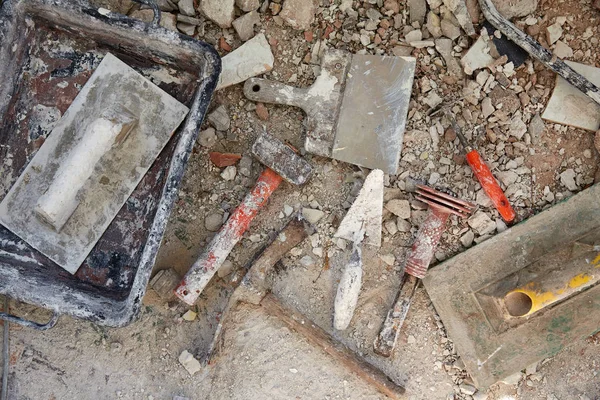 Mason tools on debris background — Stock Photo, Image