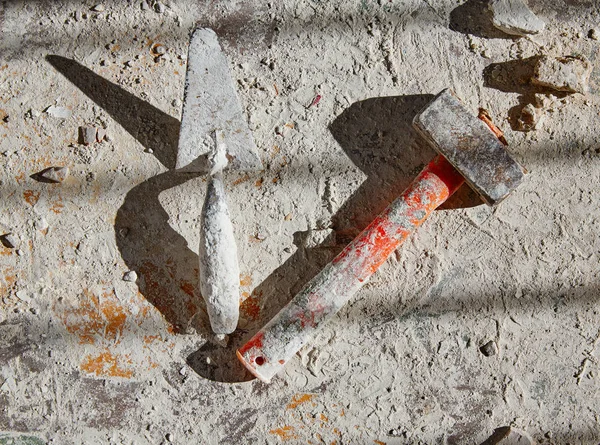 Mason tools on debris background — Stock Photo, Image