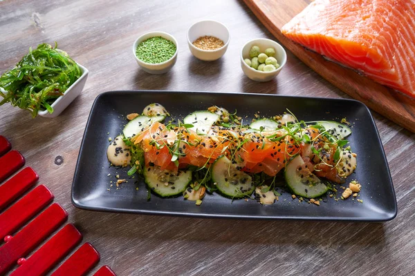 Wakame algae salmon salad and wasabi sesame — Stock Photo, Image