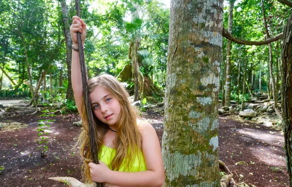 Caucasian girl playing in rainforest jungle — Stock Photo, Image