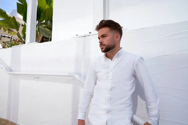 Young beard man in a white starway — Stock Photo, Image