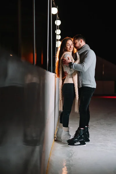 Date lovers in winter rink skates. Concept of Christmas holidays, caring for your loved one.