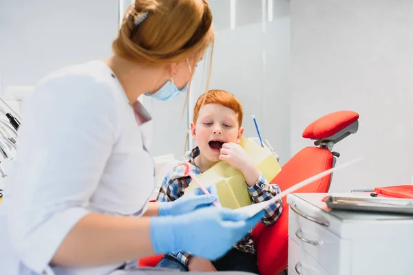 Boy satisfied with the service in the dental office. concept of pediatric dental treatment