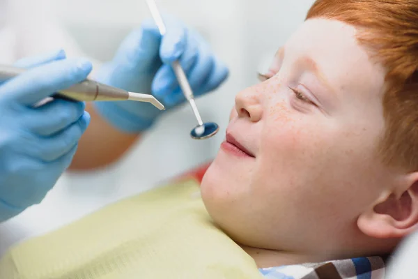 Boy satisfied with the service in the dental office. concept of pediatric dental treatment