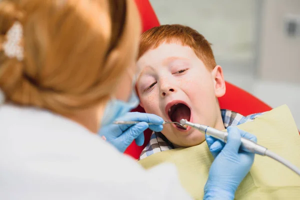 Boy satisfied with the service in the dental office. concept of pediatric dental treatment