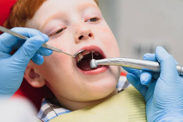 Female dentist and child in a dentist office