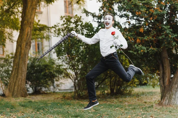 stock image young Funny mime shows something.