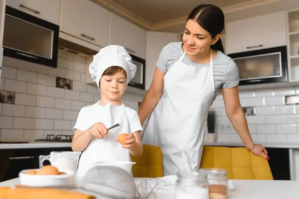 Happy Mother Her Little Son Shaking Raw Eggs Bowl Making — Stockfoto