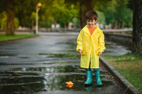 Child Playing Toy Boat Puddle Kid Play Outdoor Rain Fall — Stock Photo, Image