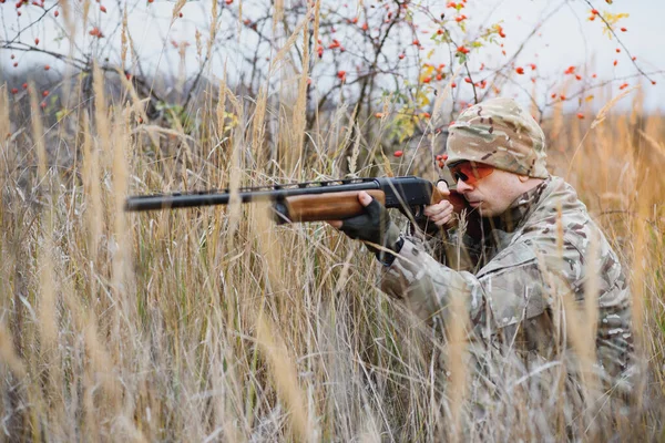 Hunting permit. Man brutal gamekeeper nature background. hunter spend leisure hunting. Hunter hold riffles. Focus and concentration of experienced hunter. Hunting and trapping seasons.