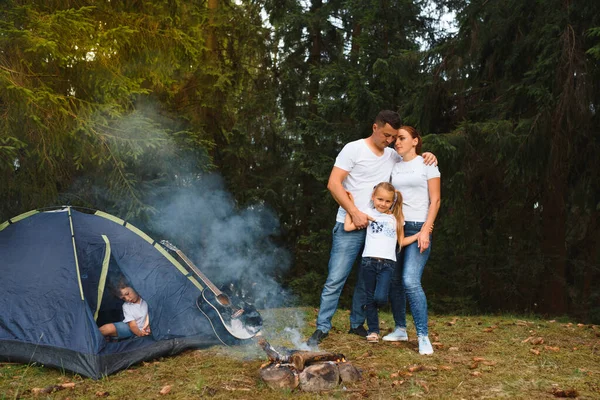 Happy Family Camping. family vacation in the mountains camp