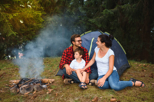 Happy Family Camping. family vacation in the mountains camp