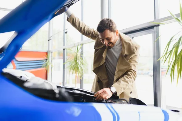 Visiting Car Dealership Handsome Bearded Man Stroking His New Car — Stock Photo, Image
