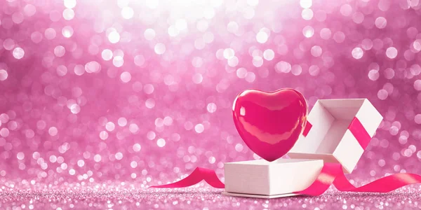 Geschenk mit Herz auf rosa glänzendem Hintergrund — Stockfoto