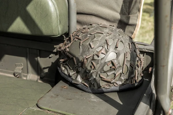 Military helmet with camouflage