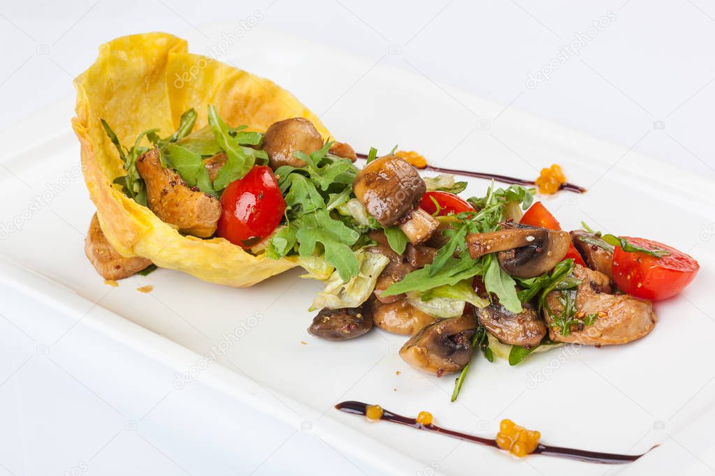 mushroom salad with Arugula and cherry tomatoes on plate