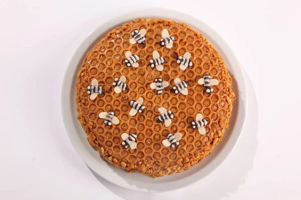 Honey cake with decoration of sweet bees