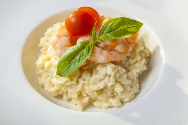 risotto with shrimp on white plate
